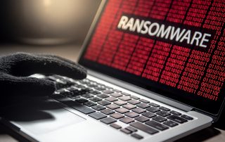 Hacker,Hand,On,Laptop,Computer,Keyboard,With,Red,Binary, ransomware