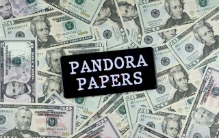 Pandora Papers on a pile of money