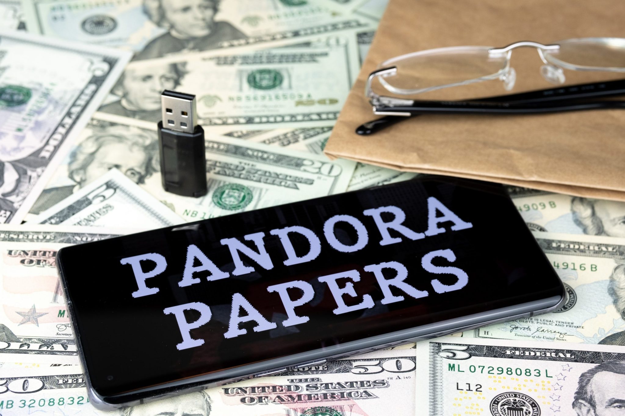 Pandora Papers on pile of money