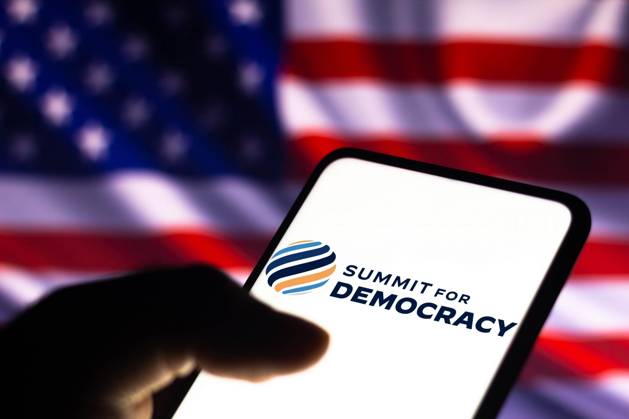 summit for democracy logo in front of american flag