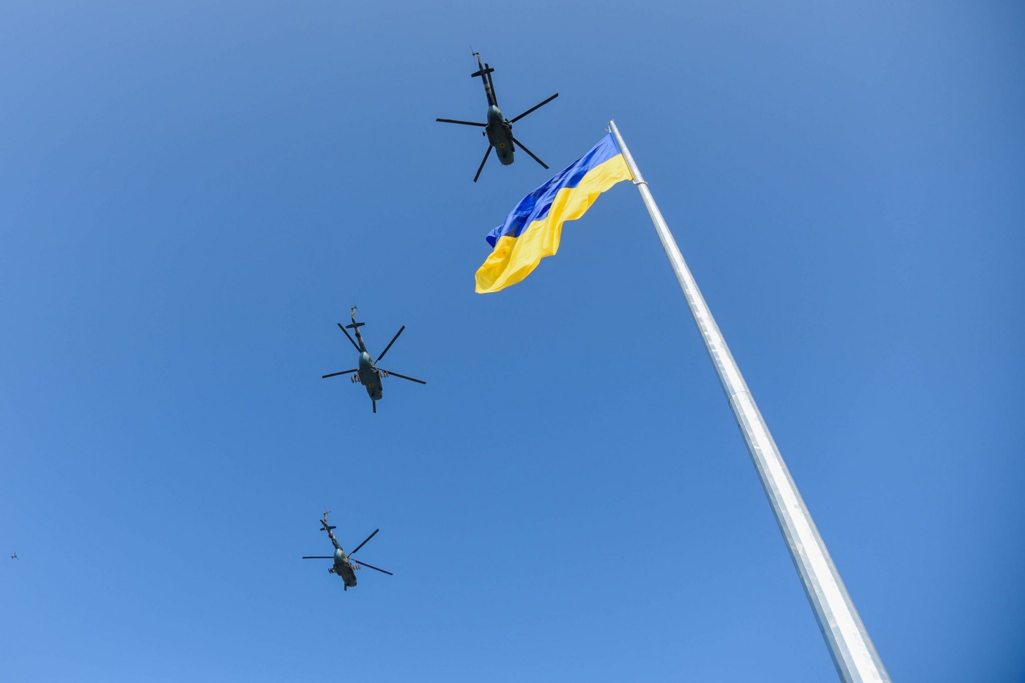 POLTAVA, UKRAINE - AUGUST 23, 2021: Flagpole with the flag of Ukraine during the celebrations on the occasion of the Day of the State Flag of Ukraine