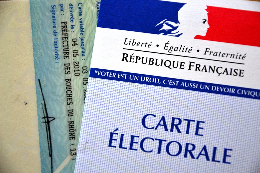 Marseille, France - March 29, 2015 : An electoral card during the first round of the French departementales elections.