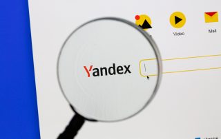 Ostersund, Sweden - Sep 15, 2021 Yandex website under a magnifying glass.