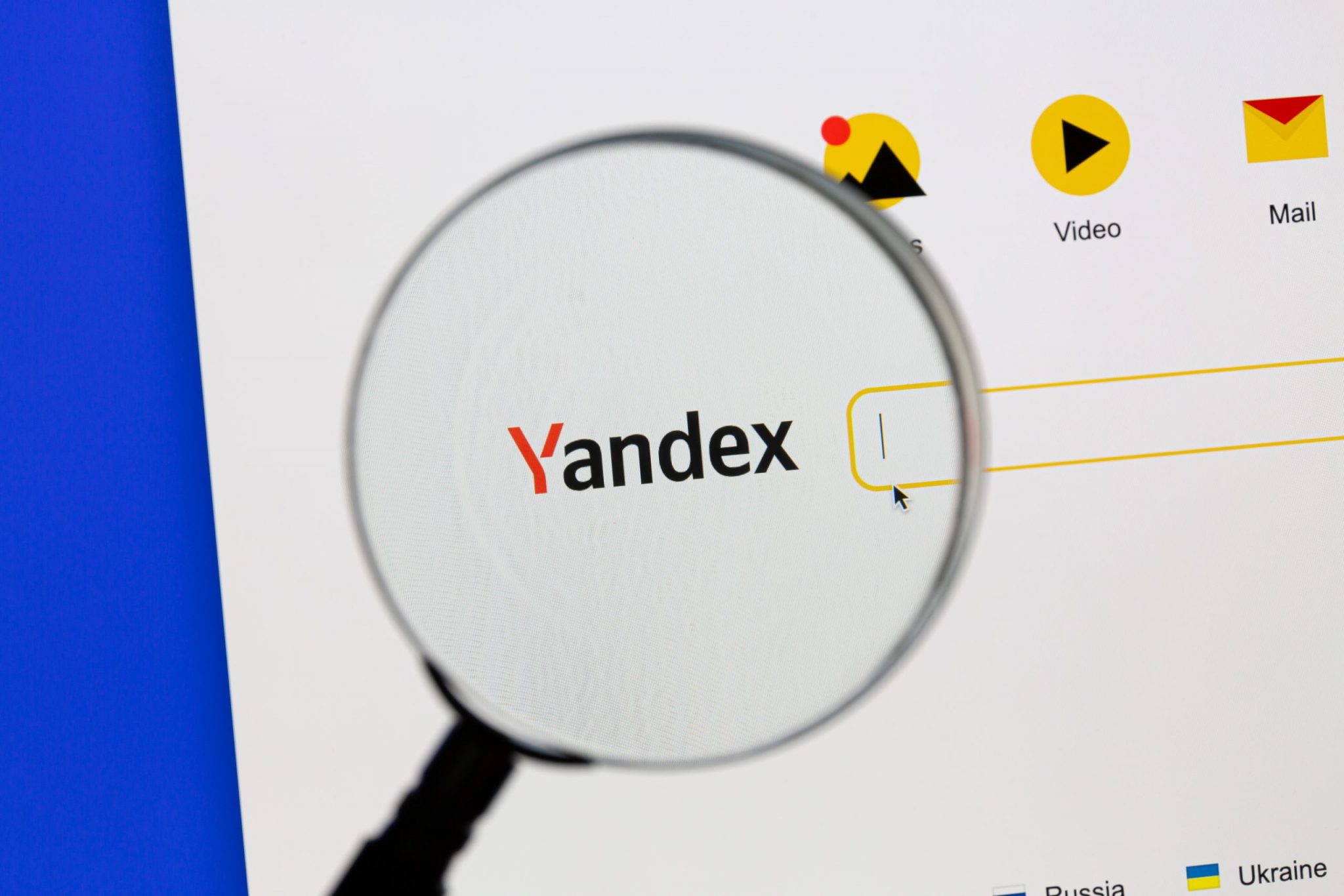 Ostersund, Sweden - Sep 15, 2021 Yandex website under a magnifying glass.