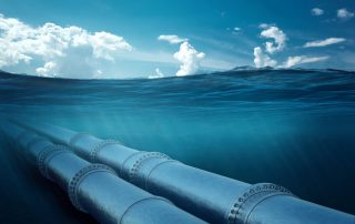 Gas pipeline under water, metal pipes at the bottom of the sea. The concept of oil pipeline, gas pipeline, gas transportation.