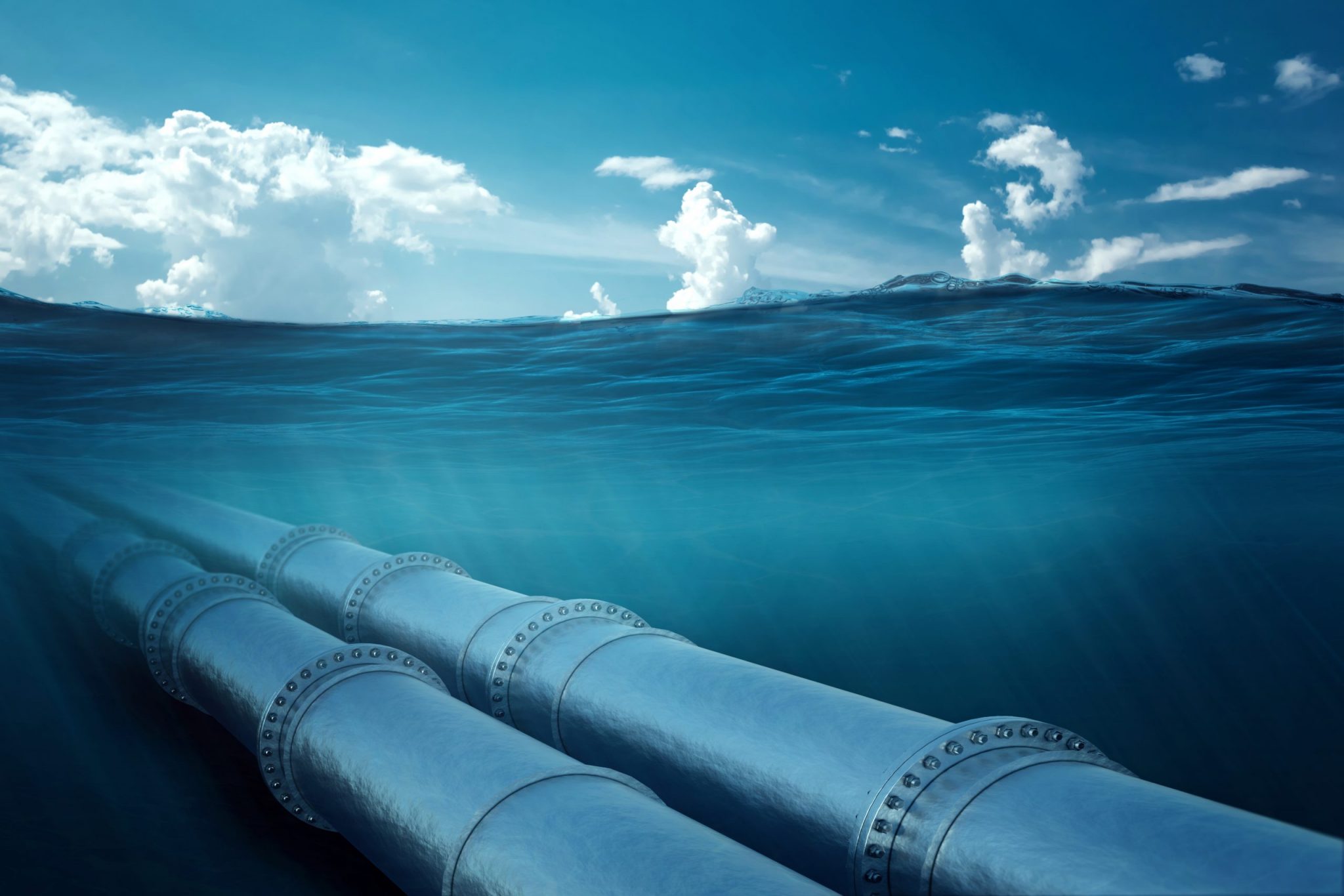 Gas pipeline under water, metal pipes at the bottom of the sea. The concept of oil pipeline, gas pipeline, gas transportation.