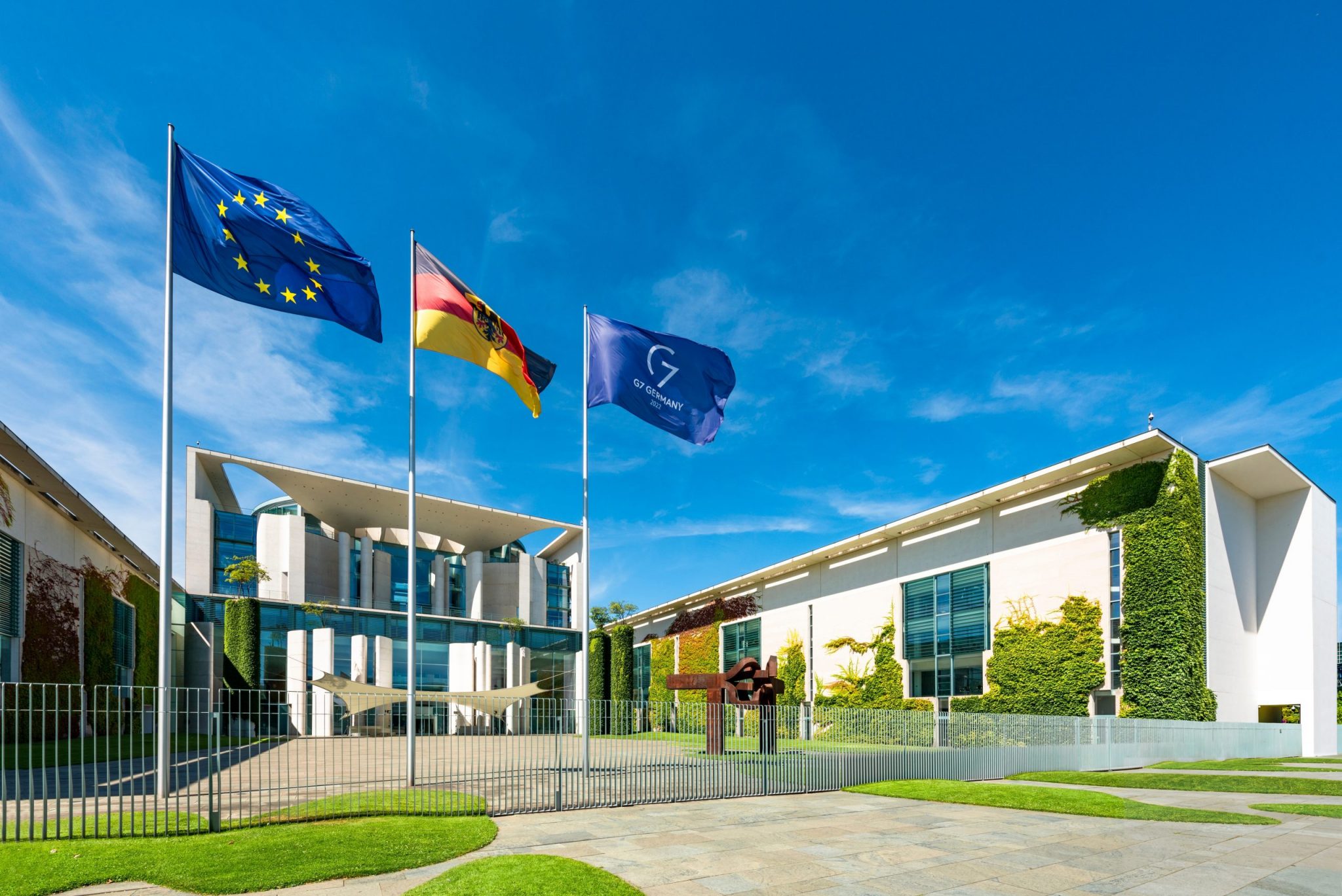 The German Chancellery in Berlin with flags of the European Union, Germany and the G7, August 3, 2022