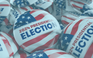 Closeup shot of one presidential election 2024 button in focus in between many other buttons in a box