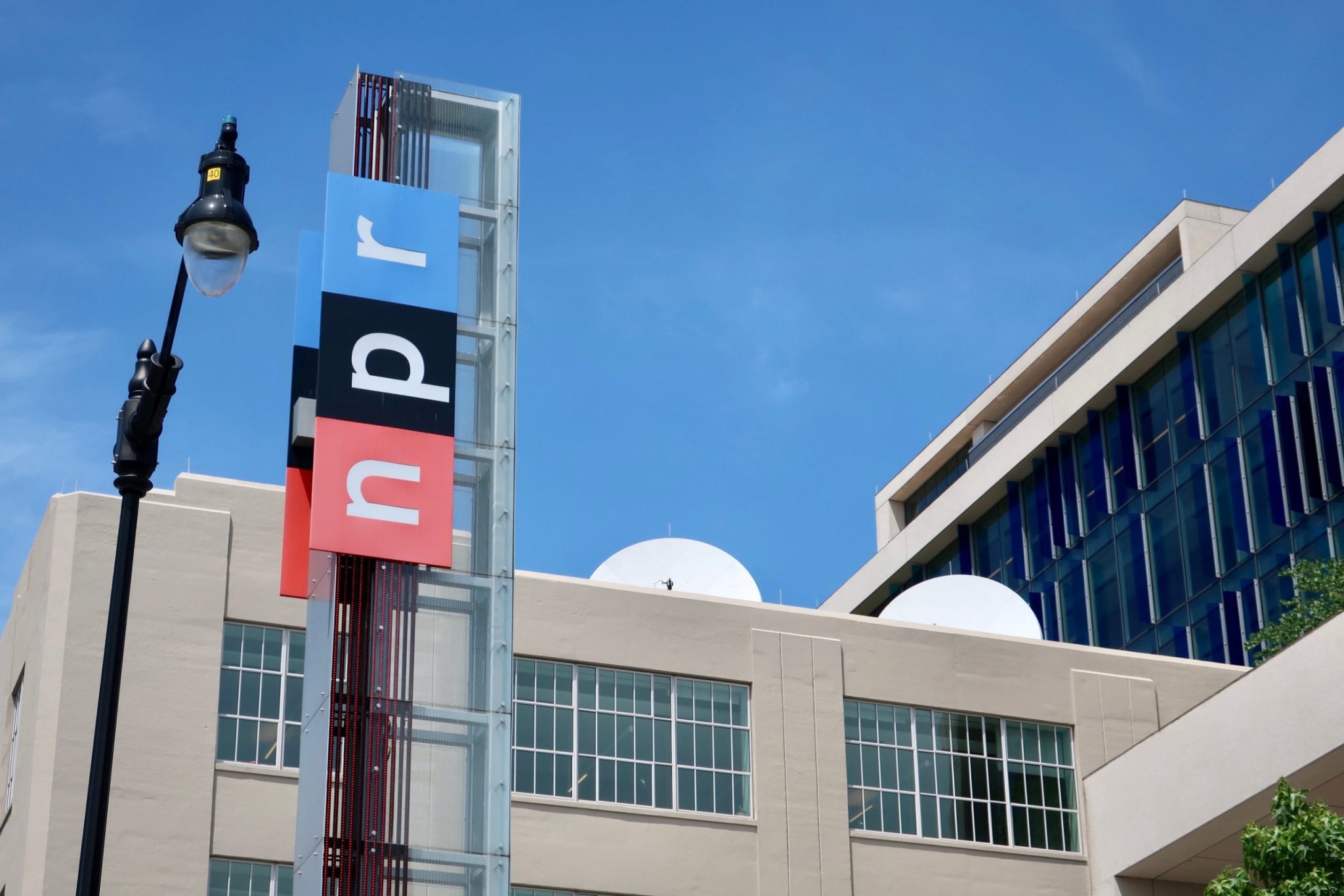 WASHINGTON, DC - JUNE 8, 2019: NPR - NATIONAL PUBLIC RADIO - sign at headquarters building entrance
