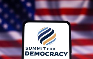 December 9, 2021, Brazil. In this photo illustration the Summit for Democracy logo seen displayed on a smartphone with American flag in background