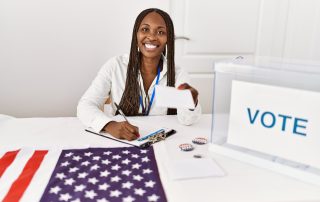 Young african american politic party worker holding vote at electoral college.