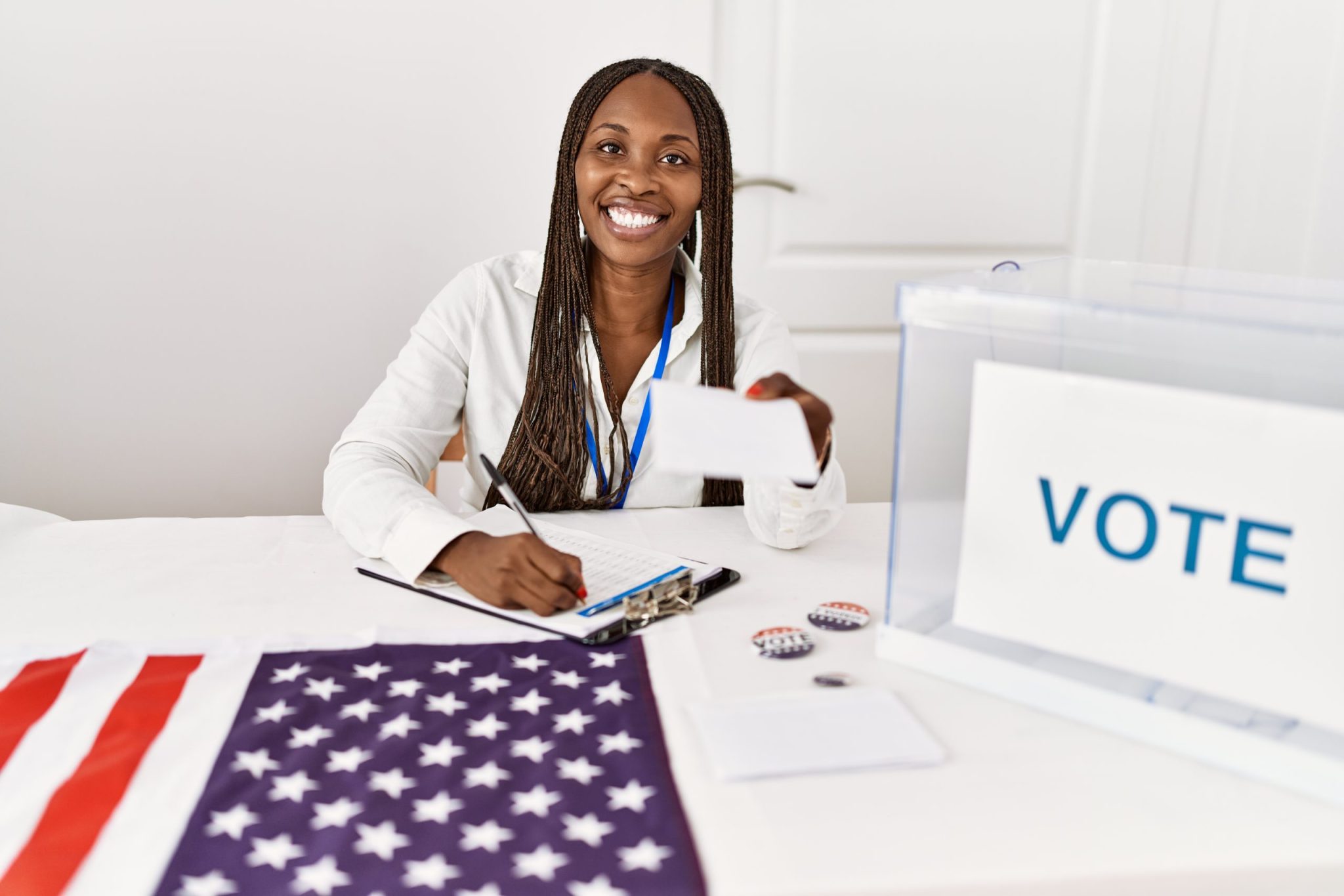 Young african american politic party worker holding vote at electoral college.