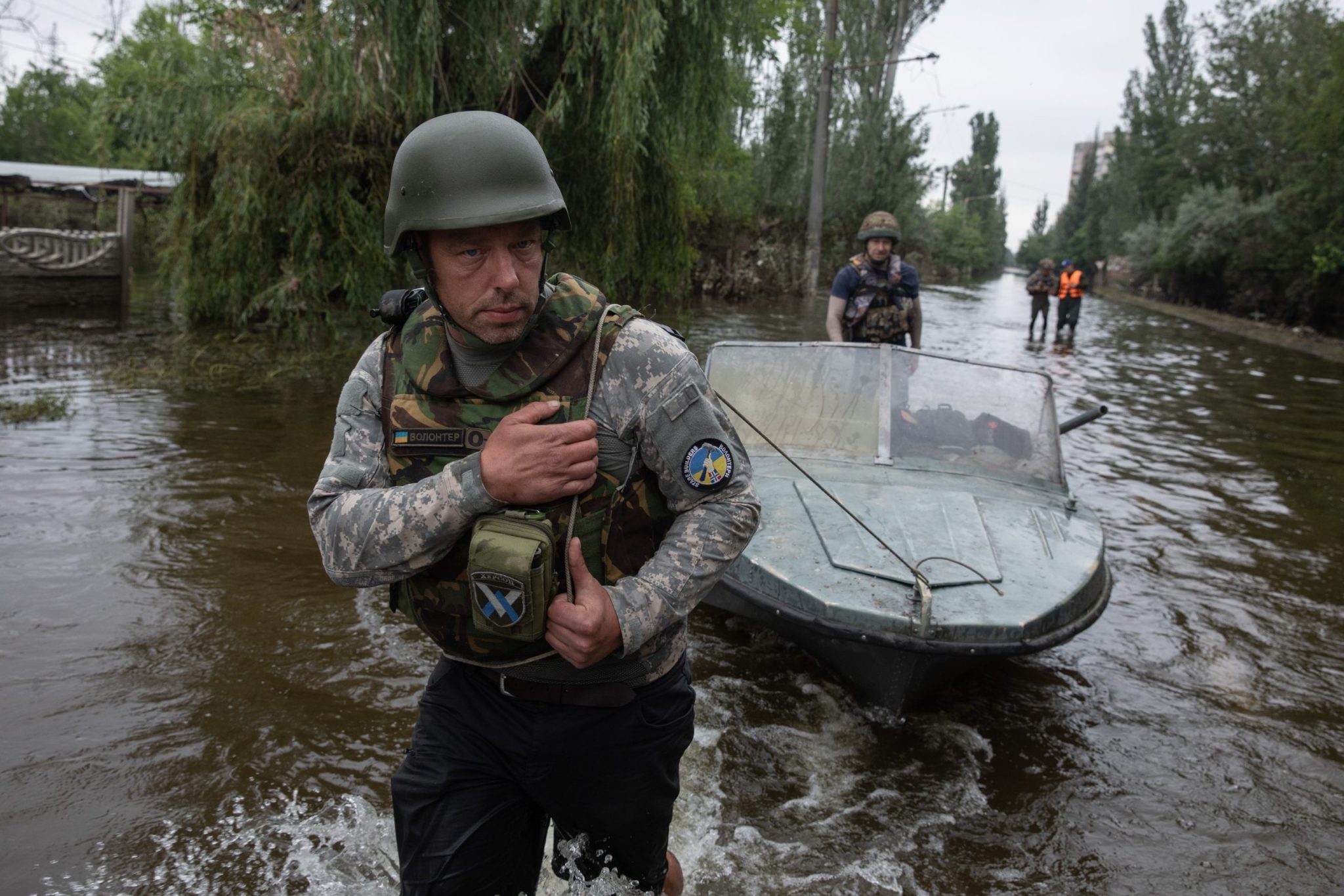 KHERSON, UKRAINE - Jun. 12, 2023: Volunteers actively helping to rescue local residents